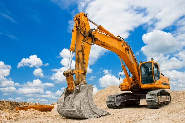 depositphotos_5823789-stock-photo-yellow-excavator-at-construction-site